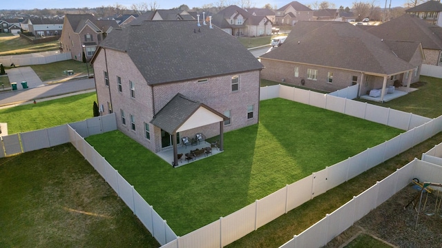 birds eye view of property with a residential view