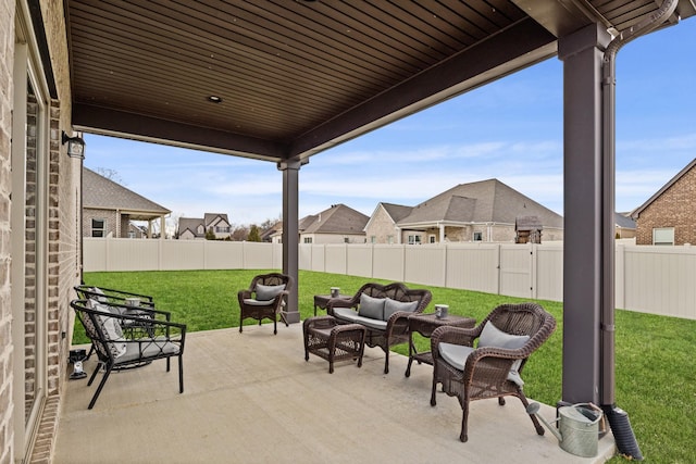 view of patio / terrace featuring a residential view and a fenced backyard