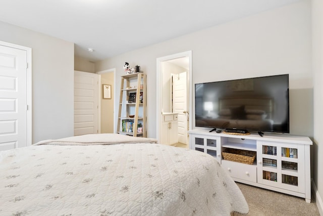 bedroom with carpet floors and ensuite bath