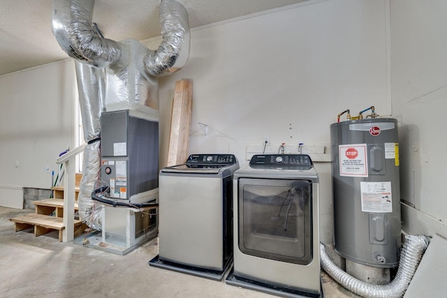 washroom with laundry area, washer and clothes dryer, and electric water heater