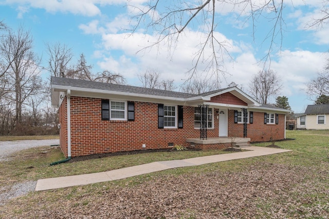 ranch-style home featuring a shingled roof, a front yard, crawl space, and brick siding