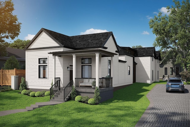 view of front of home featuring a front lawn and fence