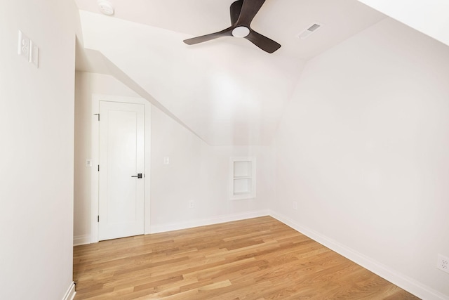 additional living space with visible vents, ceiling fan, baseboards, and wood finished floors