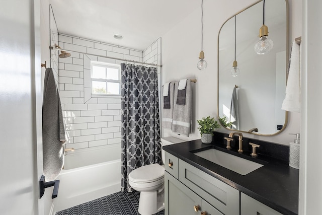 bathroom featuring shower / bath combo, vanity, and toilet