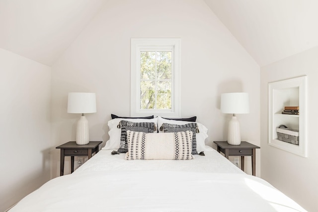 bedroom with lofted ceiling