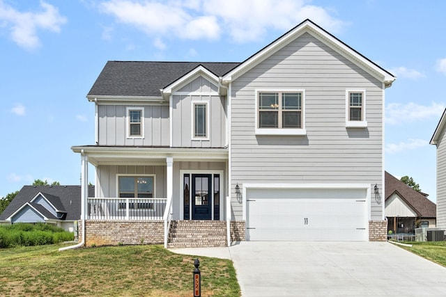 view of front of property featuring covered porch, brick siding, board and batten siding, and a front lawn