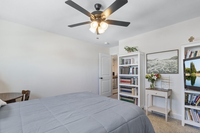 bedroom with carpet flooring, a ceiling fan, and baseboards
