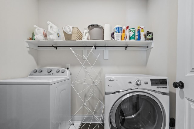 clothes washing area featuring washing machine and clothes dryer