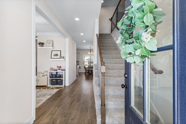 entrance foyer featuring a chandelier, recessed lighting, baseboards, stairs, and dark wood finished floors