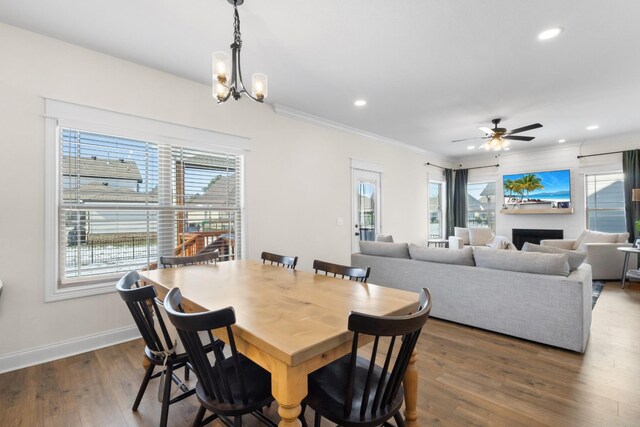 dining area featuring healthy amount of natural light, recessed lighting, a chandelier, wood finished floors, and ceiling fan