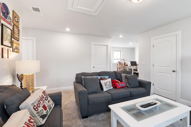 carpeted living area with baseboards, visible vents, and recessed lighting