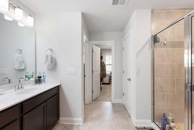 full bath featuring visible vents, a shower stall, vanity, and tile patterned floors