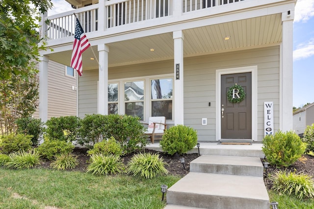 entrance to property featuring covered porch