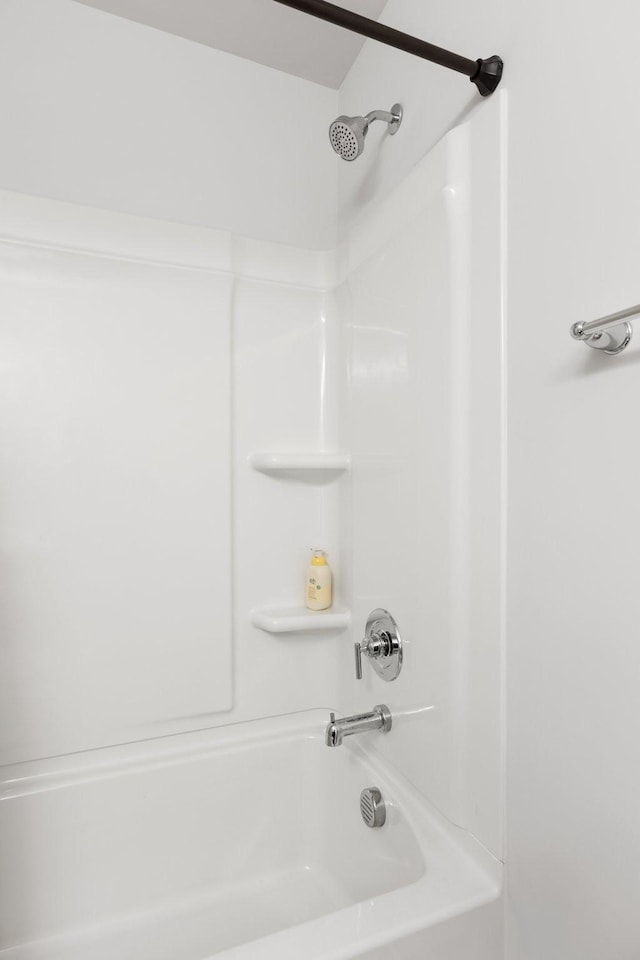 bathroom featuring  shower combination