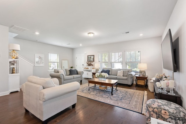 living area with dark wood-type flooring, recessed lighting, and visible vents