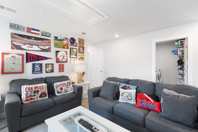 living area featuring visible vents, washer and dryer, attic access, and recessed lighting