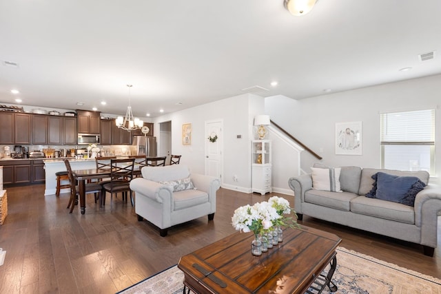 living area with dark wood-type flooring, recessed lighting, a chandelier, and visible vents