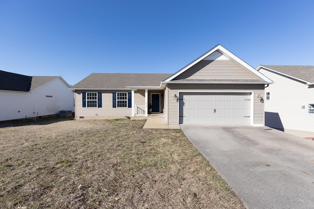 ranch-style home featuring a front lawn, crawl space, driveway, and an attached garage