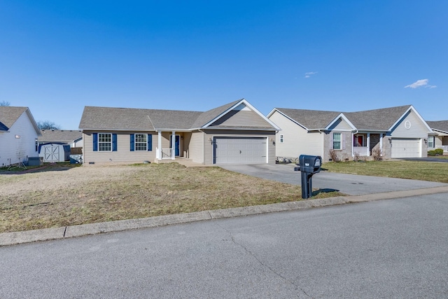 ranch-style house featuring a front yard, driveway, and an attached garage