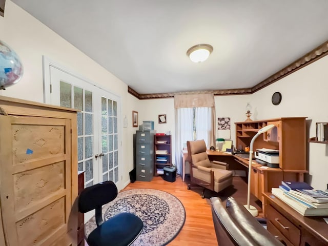 home office with french doors and light wood-style floors