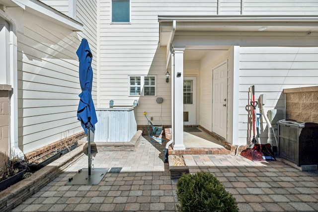 property entrance with a patio area