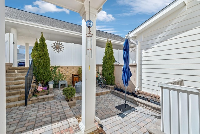 view of patio / terrace featuring fence