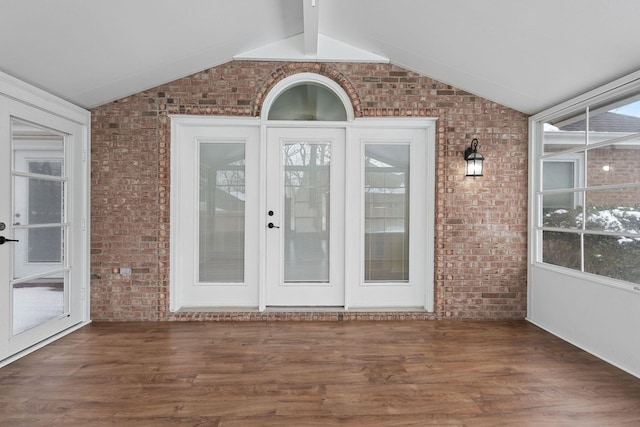 entrance to property featuring french doors and a wooden deck