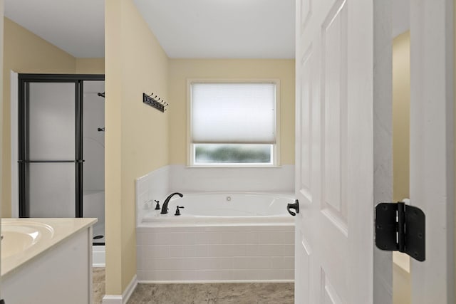 bathroom with vanity, a shower stall, and a bath