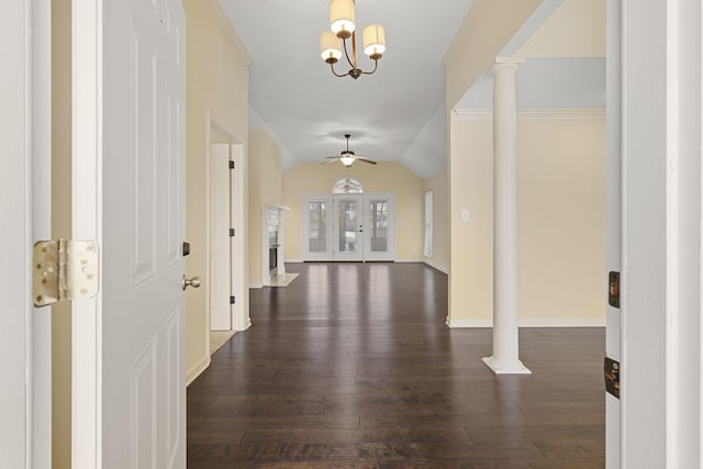 entryway with ceiling fan, dark wood-style flooring, baseboards, vaulted ceiling, and decorative columns