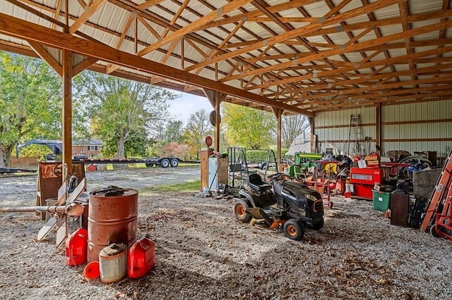 exterior space featuring a pole building, a carport, and an outdoor structure