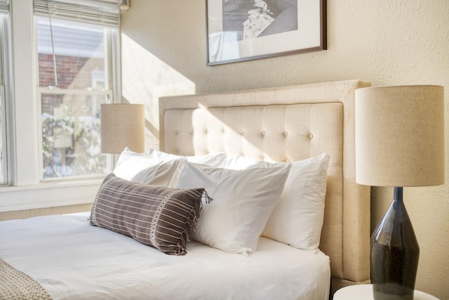 bedroom featuring a textured wall