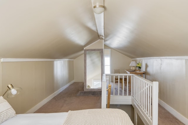 bedroom featuring vaulted ceiling, carpet flooring, and baseboards