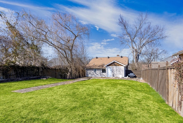 view of yard with a fenced backyard