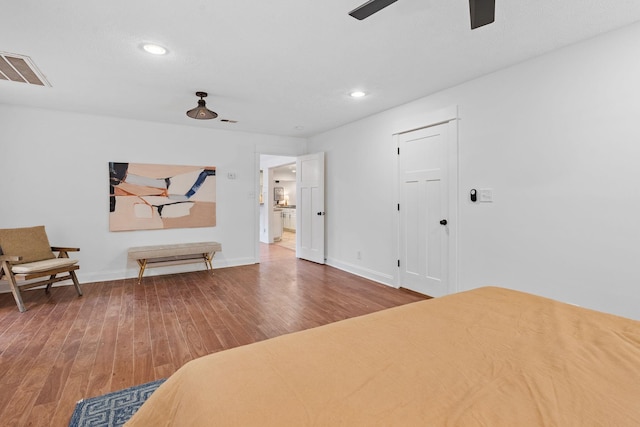 bedroom featuring recessed lighting, visible vents, baseboards, and wood finished floors