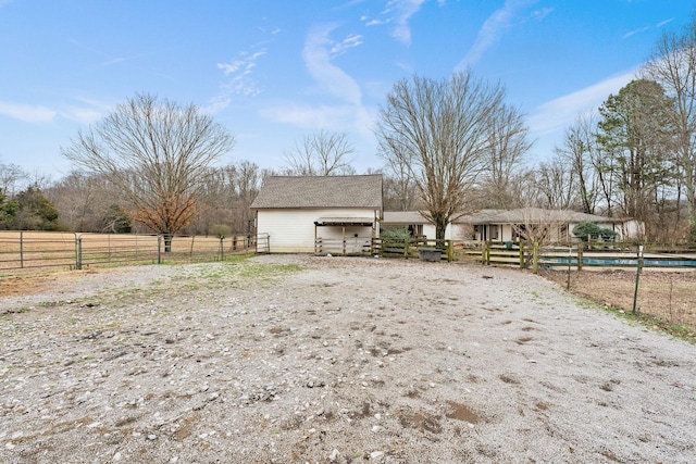 exterior space with an enclosed area and a rural view