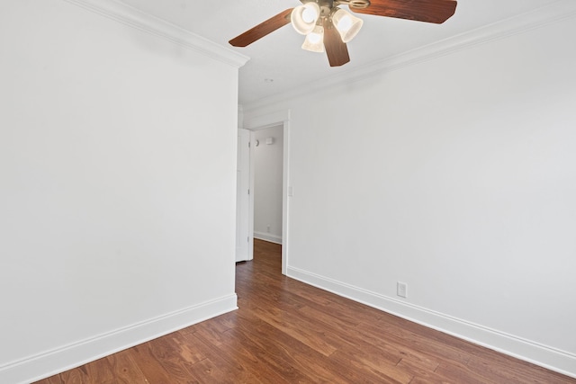 unfurnished room featuring ornamental molding, wood finished floors, a ceiling fan, and baseboards