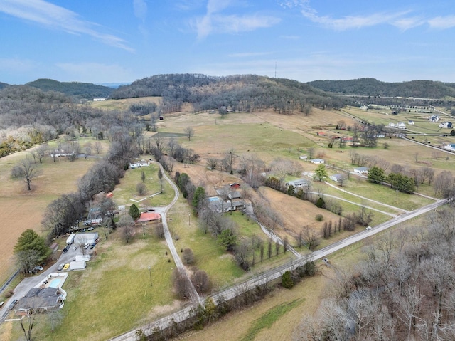 drone / aerial view featuring a mountain view and a rural view