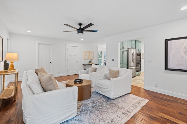 living room with dark wood-style floors, recessed lighting, a ceiling fan, and baseboards