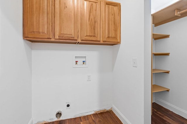 washroom featuring hookup for a washing machine, cabinet space, dark wood finished floors, and electric dryer hookup