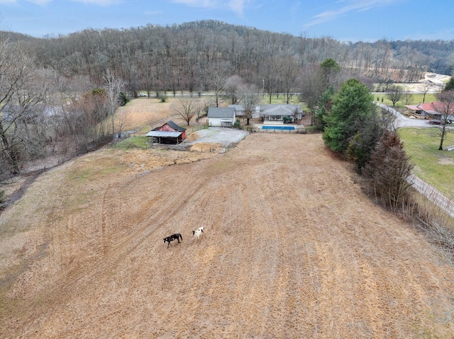 birds eye view of property with a rural view