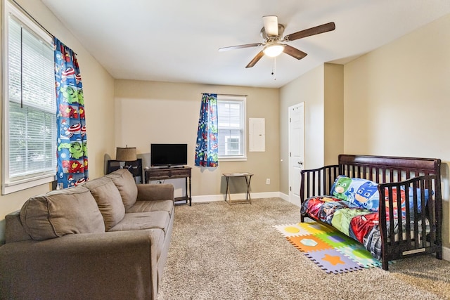 carpeted bedroom featuring a ceiling fan and baseboards