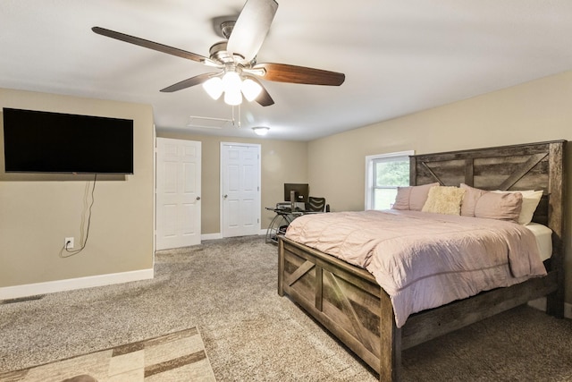 bedroom featuring a ceiling fan, light carpet, visible vents, and baseboards