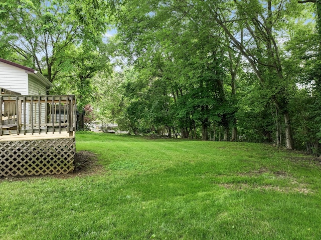 view of yard featuring a wooden deck