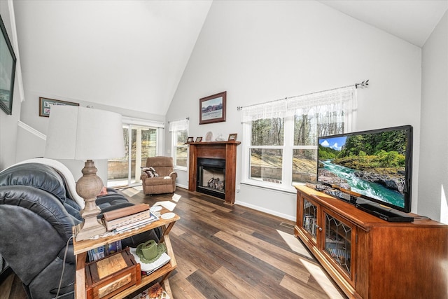 living room with dark wood-style floors, a fireplace, high vaulted ceiling, and baseboards