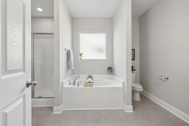 full bath featuring a bath, a shower stall, toilet, and baseboards