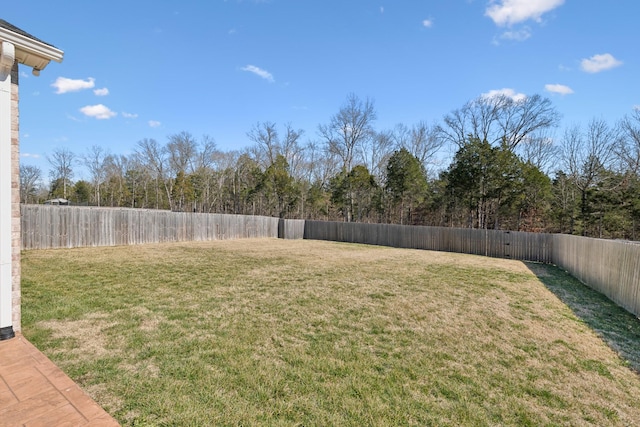 view of yard with a fenced backyard