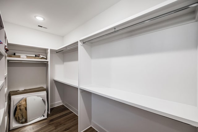 spacious closet featuring dark wood finished floors and visible vents