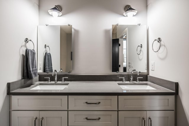 bathroom featuring double vanity and a sink