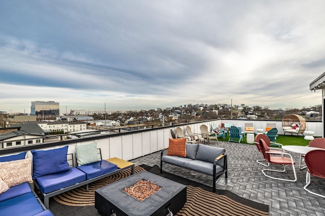 view of patio featuring an outdoor living space with a fire pit