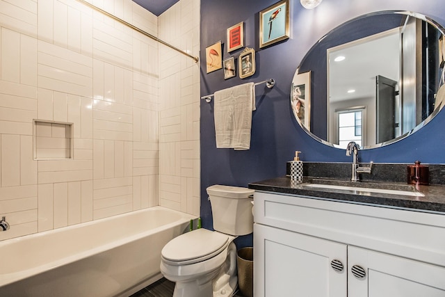 full bath with toilet, vanity, and washtub / shower combination